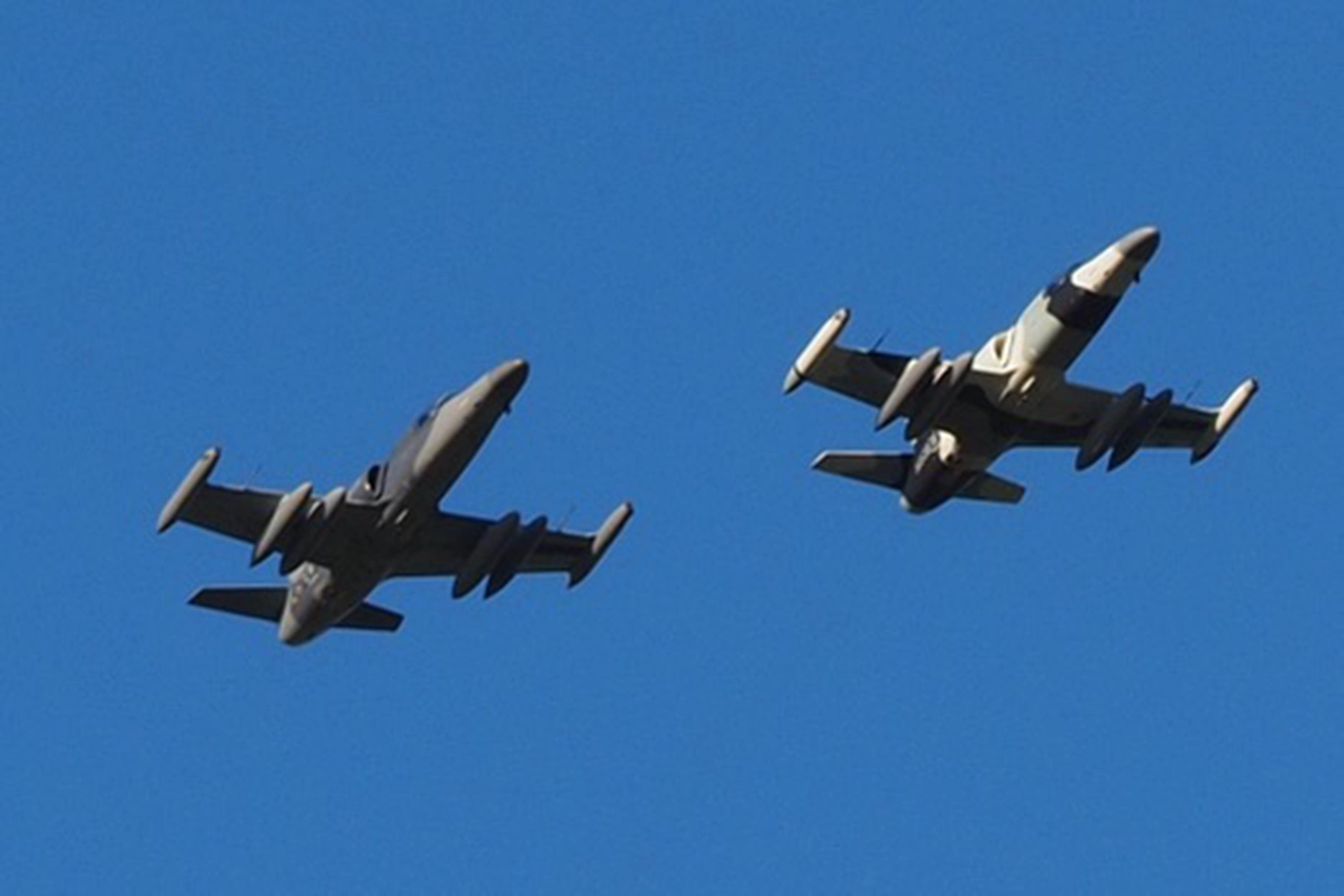 Image shows two aircraft in flight.